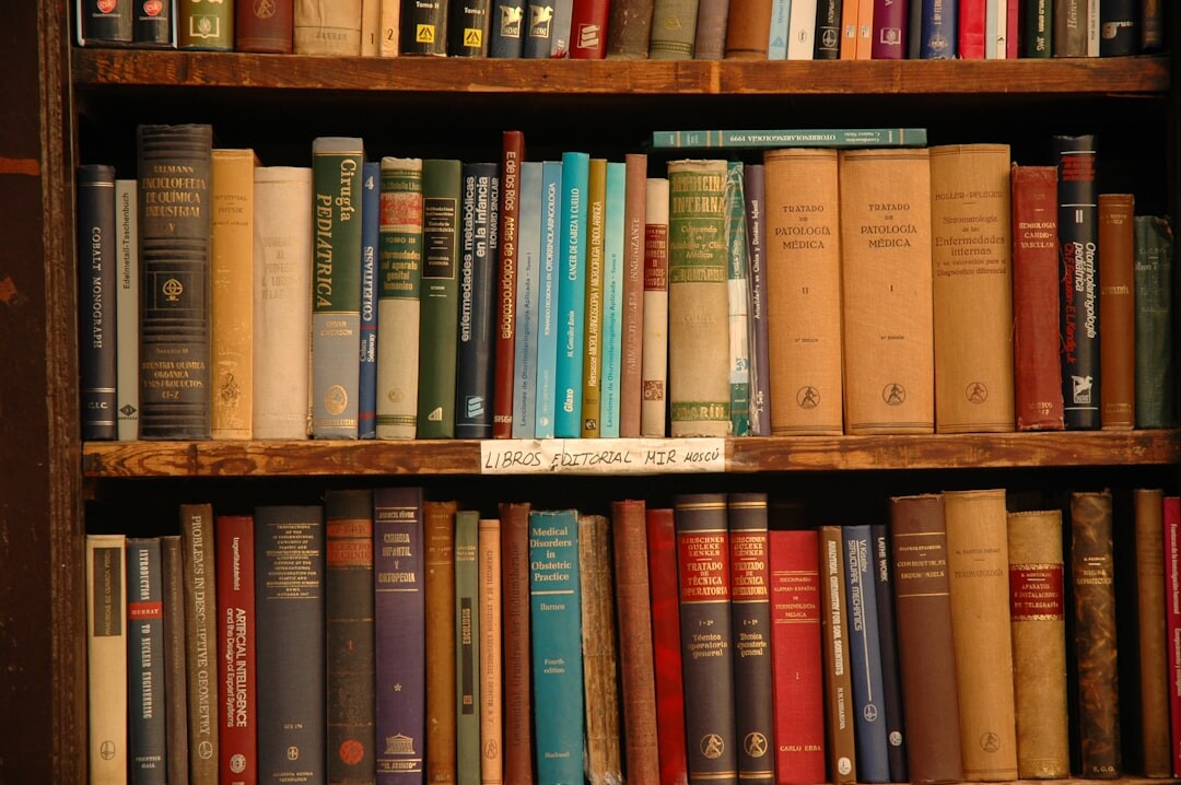 Old wooden library shelves filled with worn hardcover books